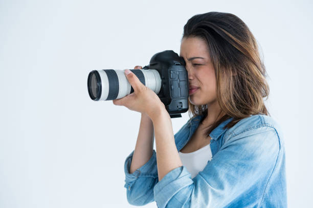 istock Female photographer with digital camera 656508756