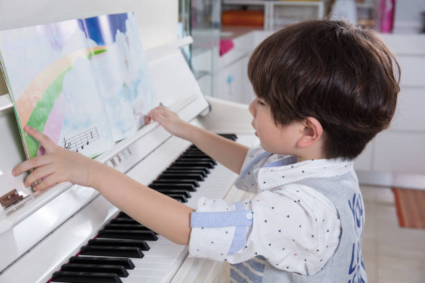 170+ Chinese Boy Playing Piano Stock Photos, Pictures & Royalty-Free