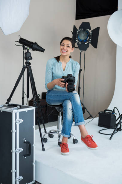 istock Happy female photographer in studio 656515488