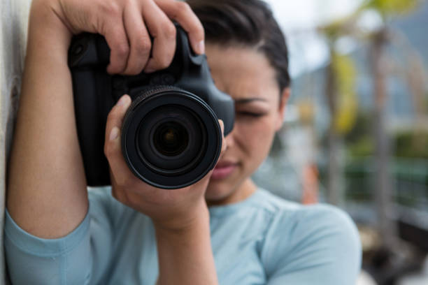 istock Female photographer with digital camera 656515586