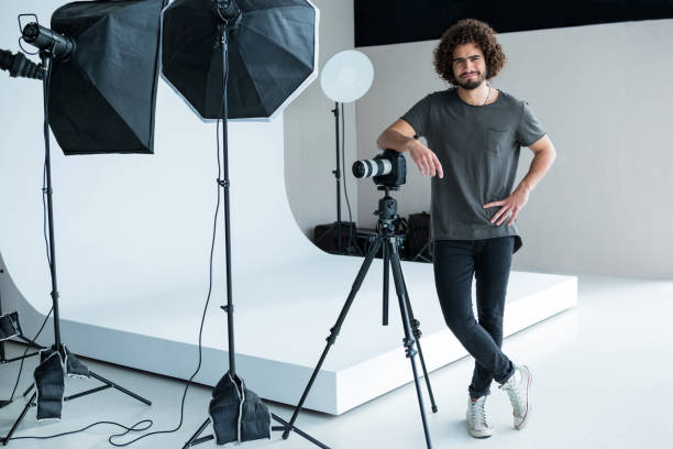 istock Happy male photographer standing in studio 656515844