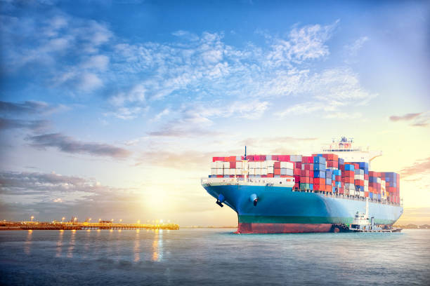 istock International Container Cargo ship in the ocean at sunset sky, Freight Transportation, Nautical Vessel 656515948