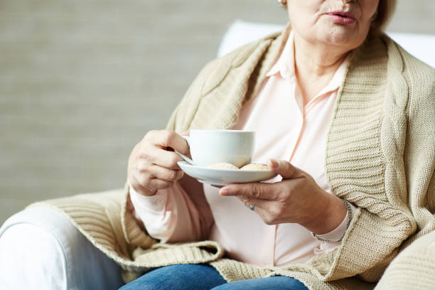 istock Elderly woman with cup of tea 656516040