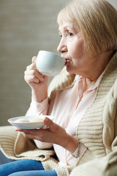 istock Senior woman drinking coffee in cafe 656516050