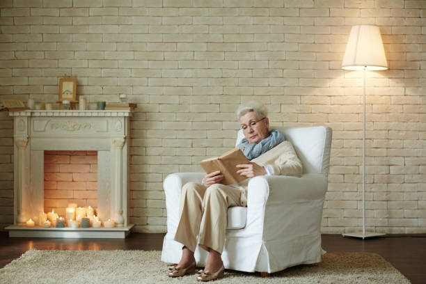 istock Elderly woman focused on reading 656516186