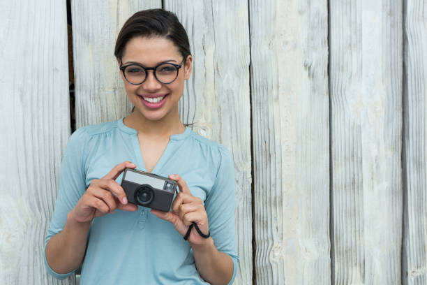 istock Female photographer with old fashioned camera 656518846
