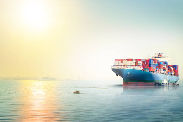 istock International Container Cargo ship in the ocean at sunset sky, Freight Transportation, Nautical Vessel 656519270