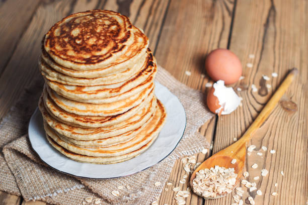 high stack of oatmeal pancakes - pancake buttermilk buttermilk pancakes equipment imagens e fotografias de stock