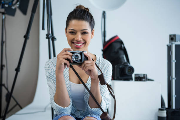 istock Happy female photographer in studio 656525420