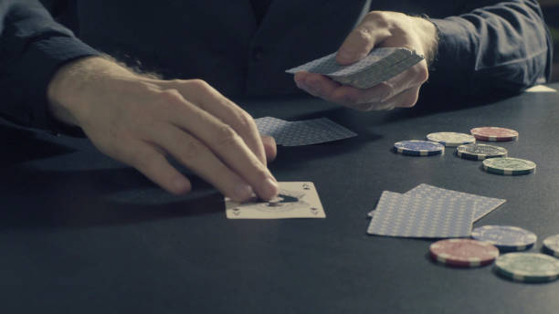 istock Poker game. Man's hands dealing cards and chips 656530366