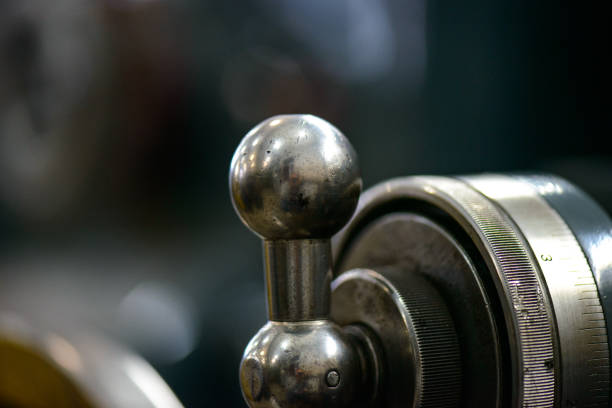 Parts and details on an old industrial lathe (industrial machining tool)