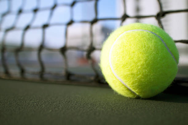 istock Tennis ball on hard court 656537852
