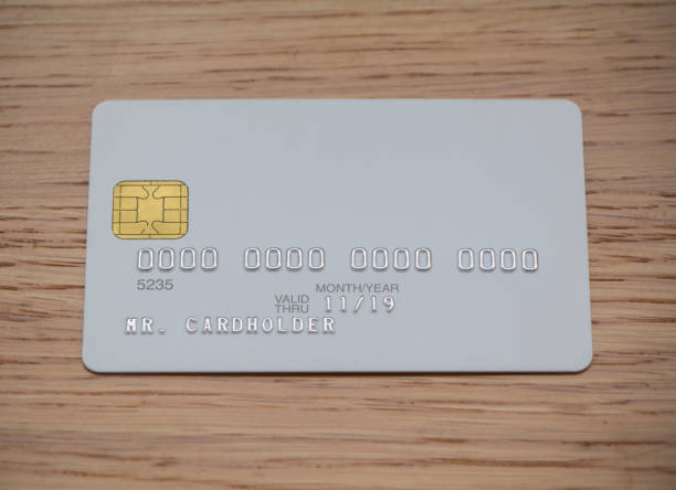 istock Blank white bank card on wooden table 656539754