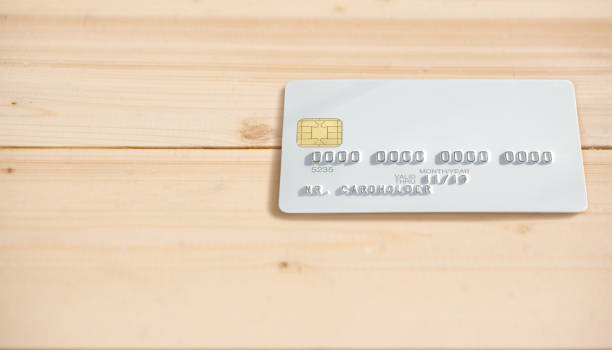 istock Blank white bank card on wooden table background 656539768