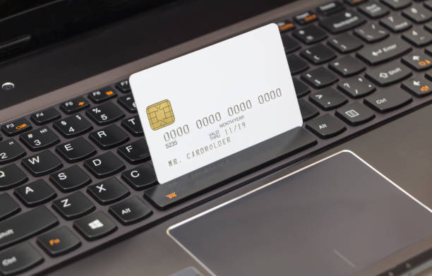 istock Blanc credit card on laptop keyboard, online shopping concept 656539940