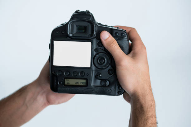 istock Close-up of photographer holding digital camera 656542196