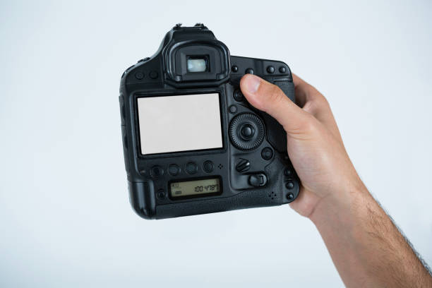 istock Close-up of photographer holding digital camera 656542308