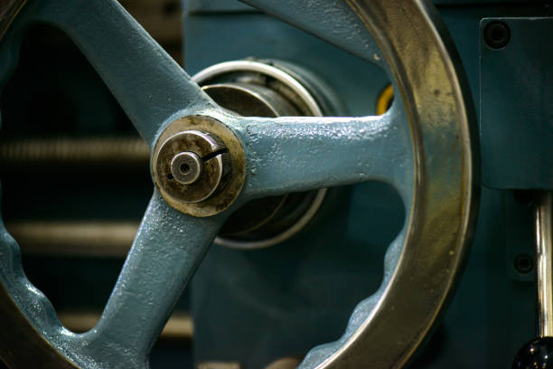 Parts and details on an old industrial lathe (industrial machining tool)