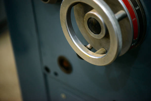 Parts and details on an old industrial lathe (industrial machining tool)