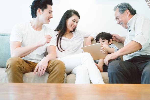 istock Multi-generation family relaxing in living room 656546734