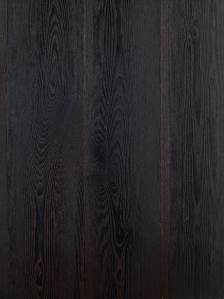 Black hardwood floor background. Ash tree wood texture. Wood parquet. Dark ash tree wood floor. Ash tree Grand Canyon wood type. stock photo