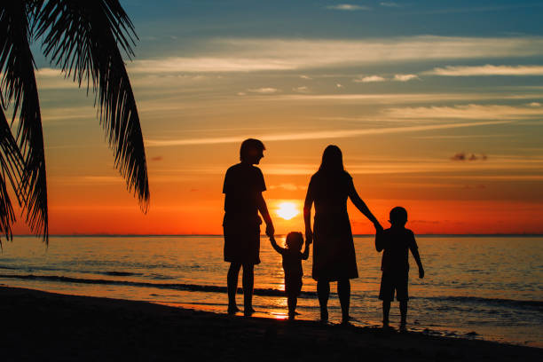 istock happy family with two kids on sunset beach 656554776