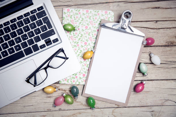 istock easter background with eastereggs and butterflies on wooden table an notebook 656554944