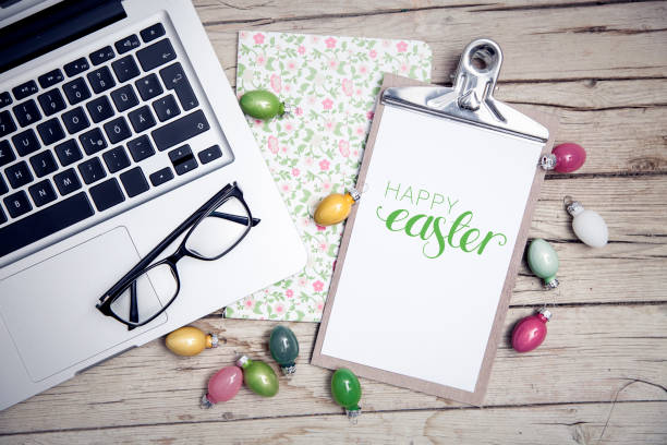 istock easter background with eastereggs and butterflies on wooden table an notebook 656554968