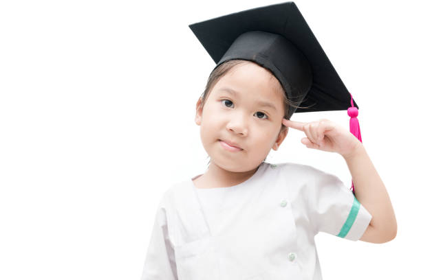 istock Asian school kid graduate thinking with graduation cap 656558460