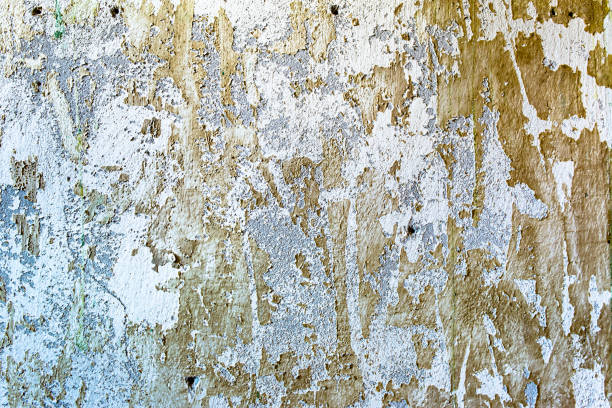 istock White texture of wall with peeled paint, background 656559644