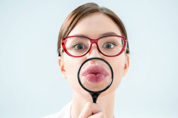 istock Woman with magnifying glass 656567706