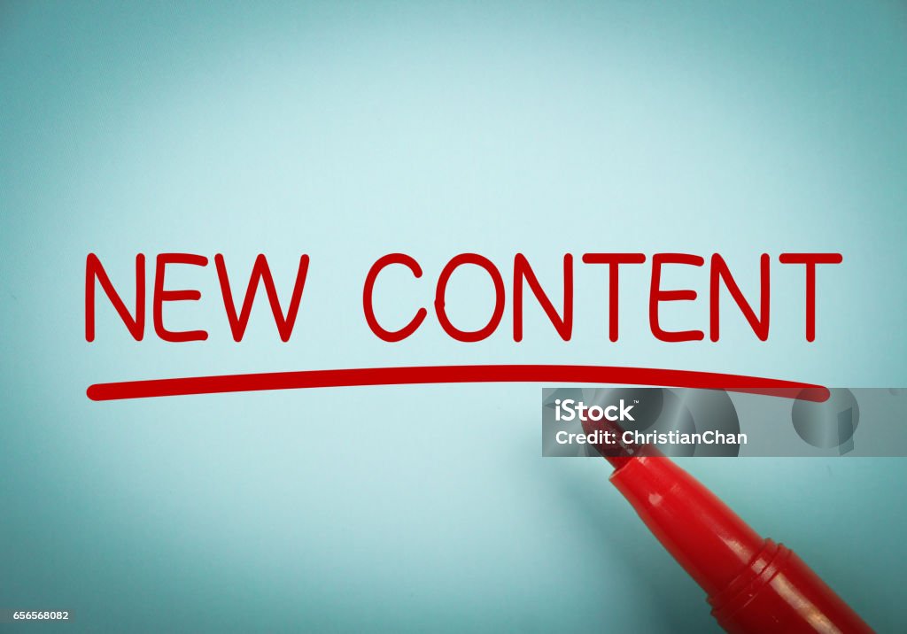 New Content New Content text with red underline is written on blue paper. Contented Emotion Stock Photo