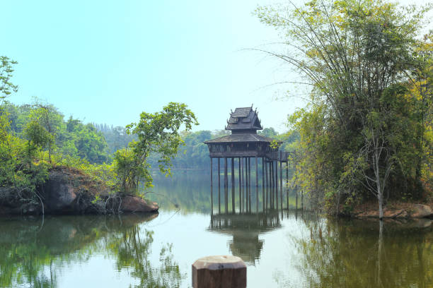 istock Reflection of Thai old style pavilion in the water. 656571302