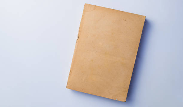 istock Old yellow book without cover isolated on white background 656571682