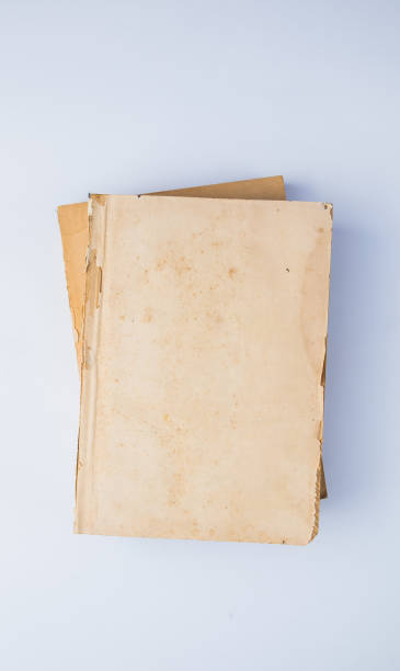 istock Old yellow books without cover isolated on white background 656571690