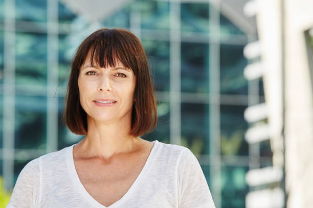 istock Older woman in city with neutral expression 656578688