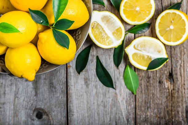 istock Fresh lemons on market table, top view 656582390