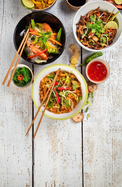 istock Asian food served on wooden table, top view, space for text 656582634