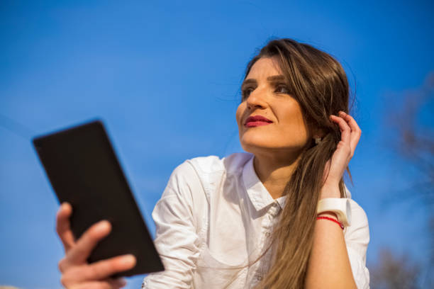 istock Cute young woman with tablet 656586584