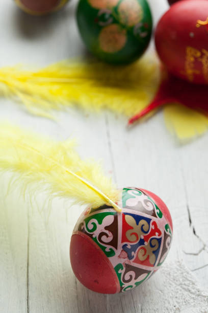 istock Easter eggs and white wooden country table, background and texture 656586652