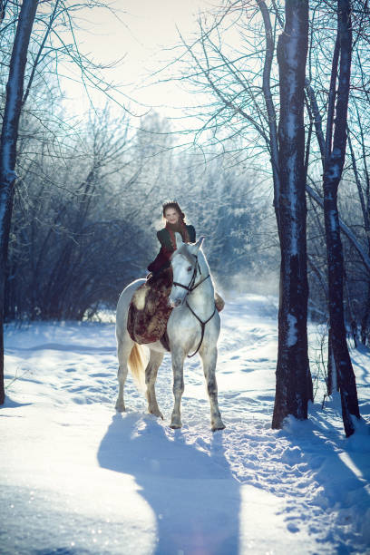 istock young woman riding a horse 656587052