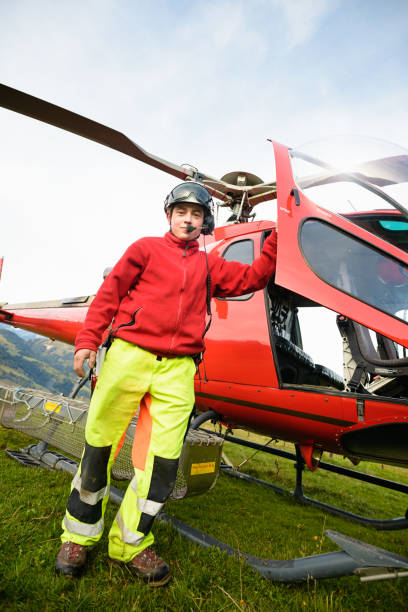 istock Paramedic Poses with Mountain Rescue Helicopter 656588354