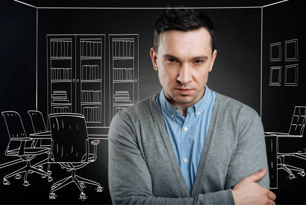 istock Serious manager standing in the office 656588358