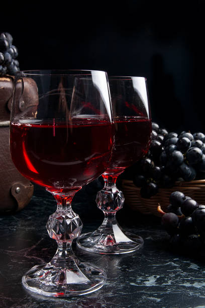 istock Glass of red wine on dark marble background. 656588862