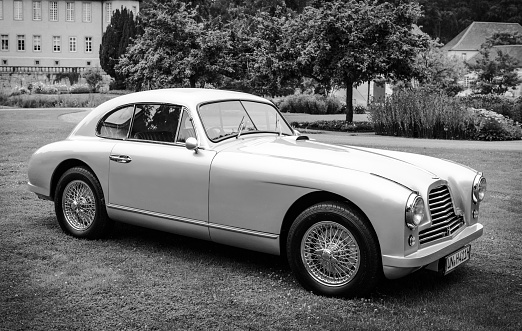 Jüchen, Germany - August 5, 2016: Aston Martin DB2 classic British sports car on display during 2016 Classic Days at Dyck castle in Germany. The 1950s sports car is fitted with a dual overhead cam 2.6 L straight-6 engine and this specific car is a closed, 2-door, 2-seater coupé which Aston Martin called a sports saloon. Classic days is an annual ticketed event on the grounds of Dyck castle.