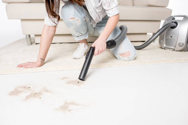istock Woman with vacuum cleaner 656596498