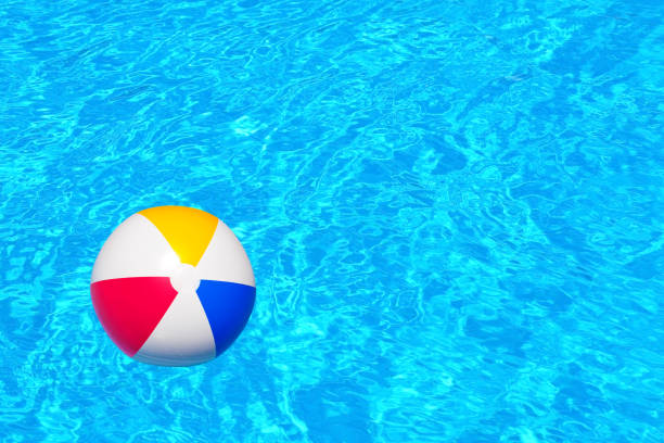 istock Colorful inflatable ball floating in swimming pool 656598846