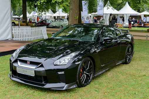 Jüchen, Germany - August 5, 2016: Black Nissan GT-R Nismo sports car on display during the 2016 Classic Days event at Schloss Dyck. The GT-R is equipped with a 3.8 L VR38DETT twin-turbo V6 producing 591 hp. Classic days is an annual ticketed event on the grounds of Dyck castle.