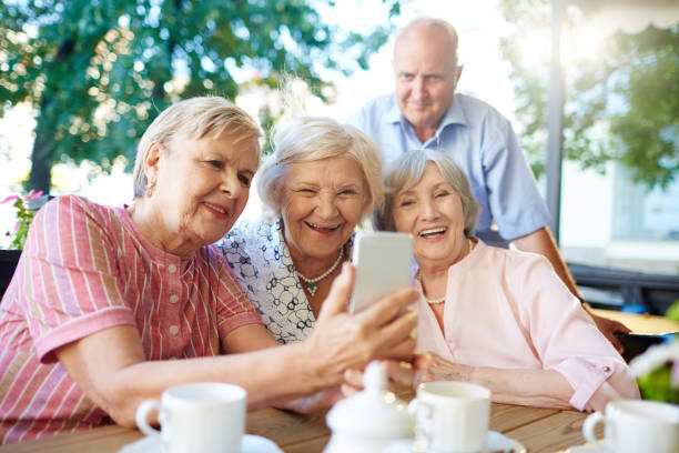 istock Modern seniors taking picture of themselves 656602386
