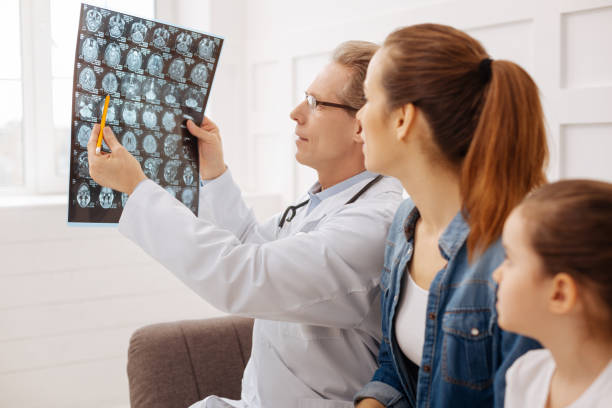 istock Polite competent doctor explaining some detail to his patient 656603576